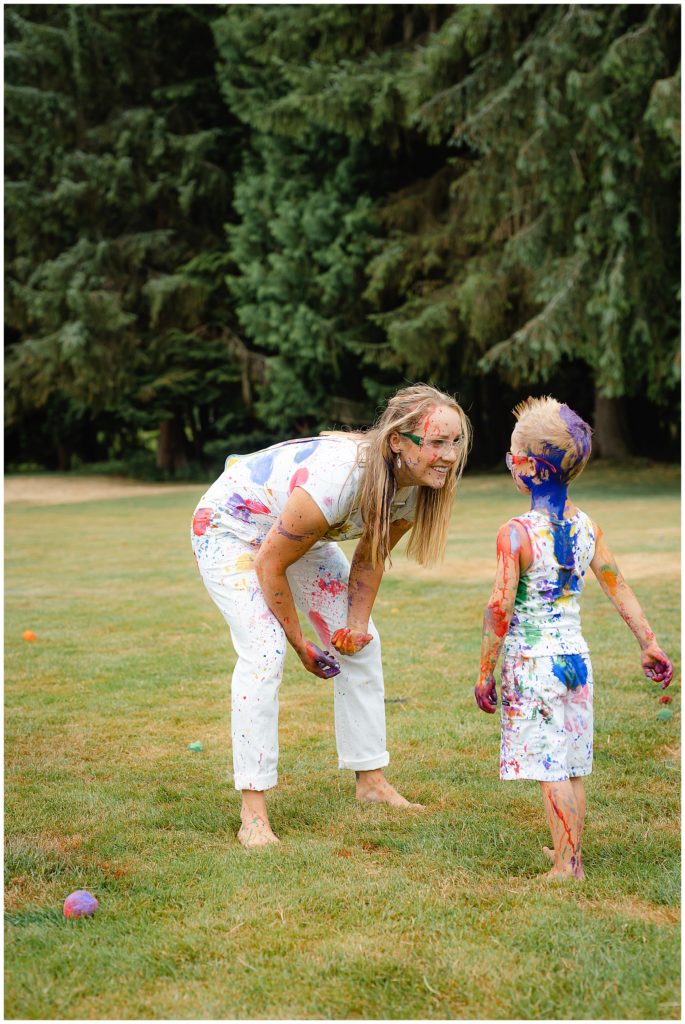Mom and son having a paint war for family photos 2022 in Boise, Idaho