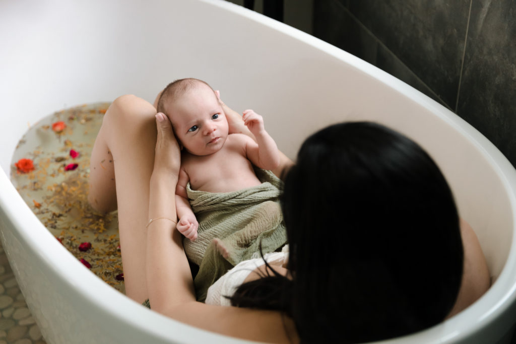 mom and baby in postpartum sitz bath