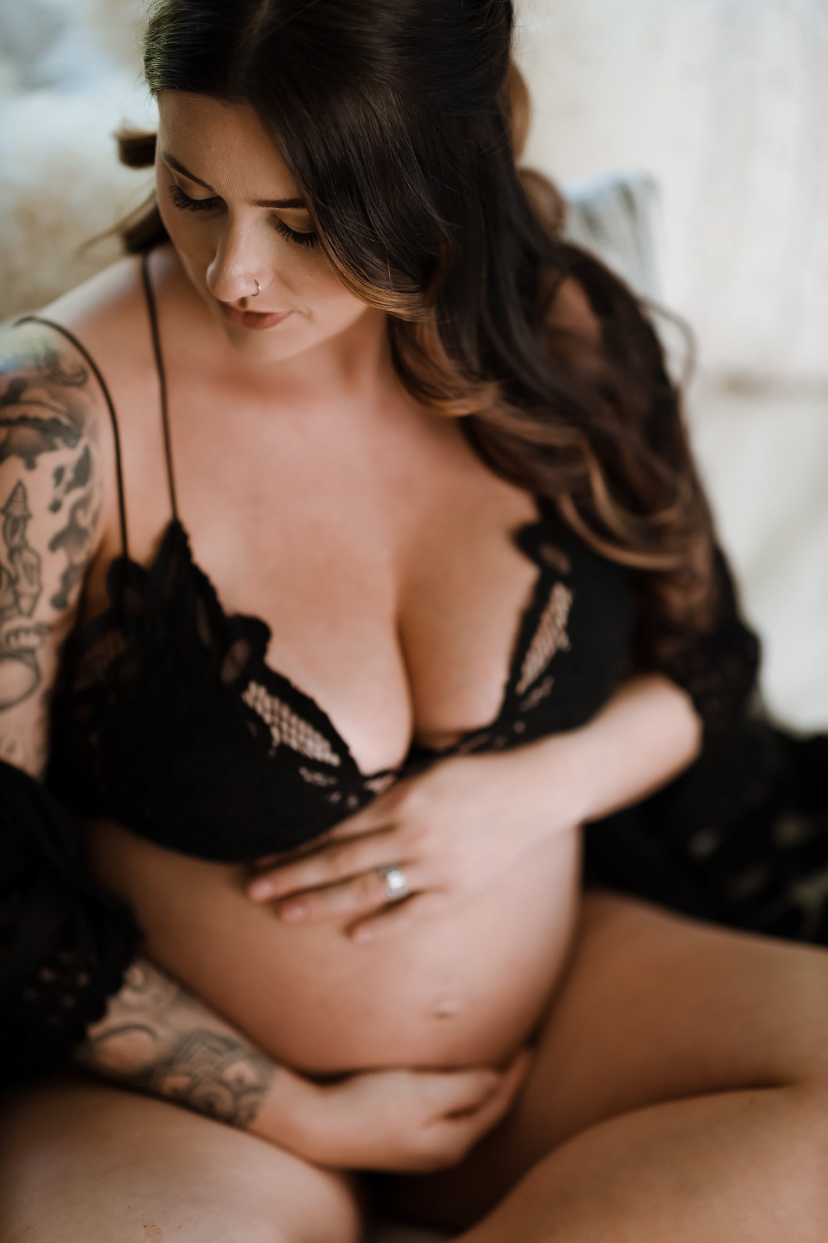 Pregnant woman in black lace bra