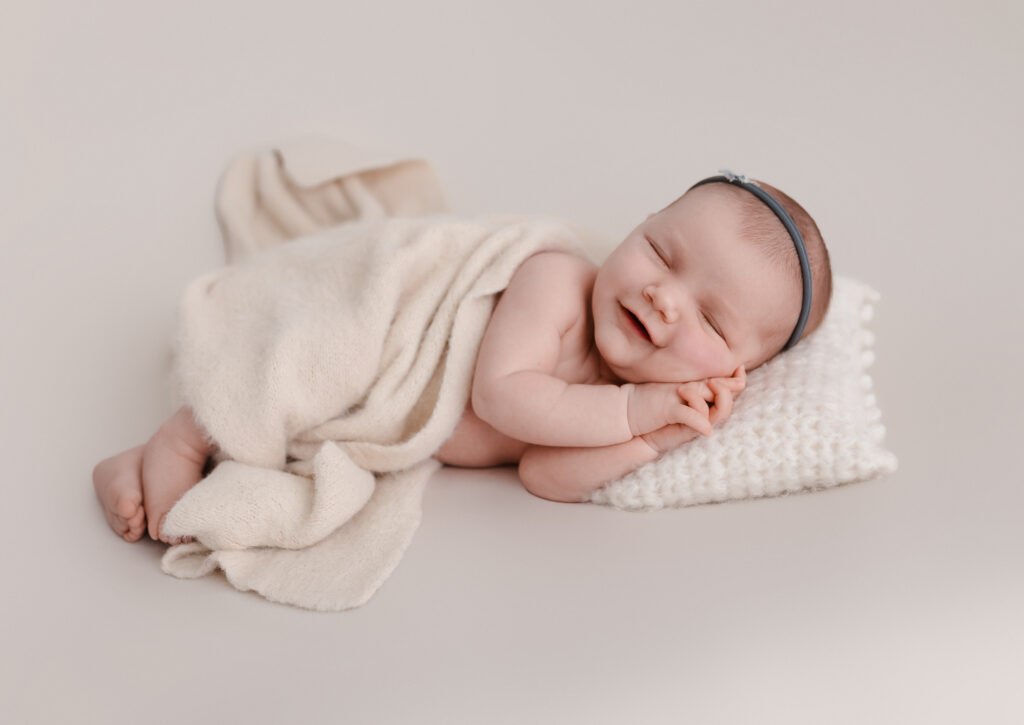 smiling picture of a newborn baby