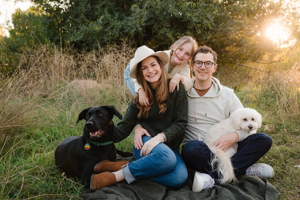 Family portrait with pre-teen daughter and two dogs in Boise autumn scenery