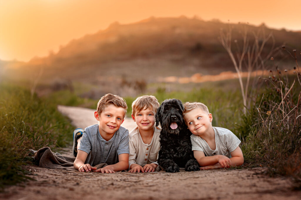 Family portrait with beloved dog Mayla, highlighting the importance of including pets in family photos