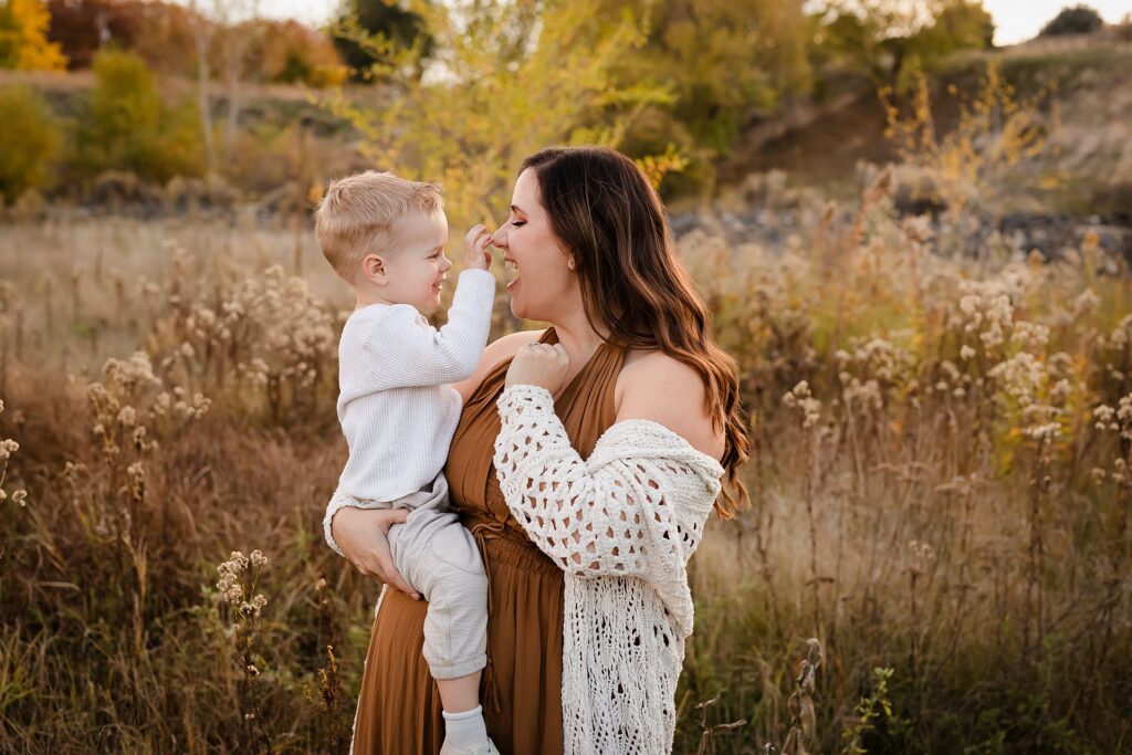 Mother and son in coordinated fall outfits for family photo