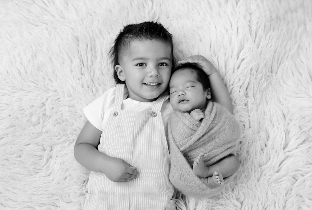 Importance of newborn photography: capturing sibling bonds