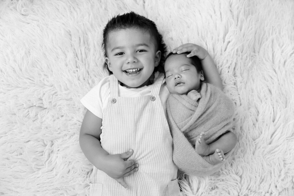 Importance of newborn photography: capturing sibling bonds