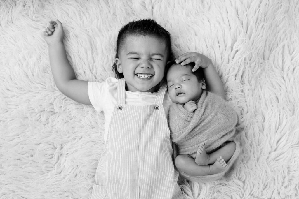 Importance of newborn photography: capturing sibling bonds