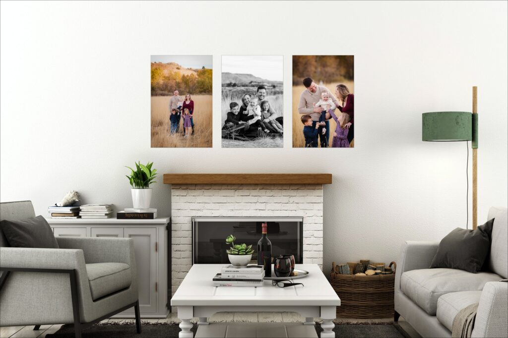 creative photo display of 3 family photos on a living room wall above the fire place