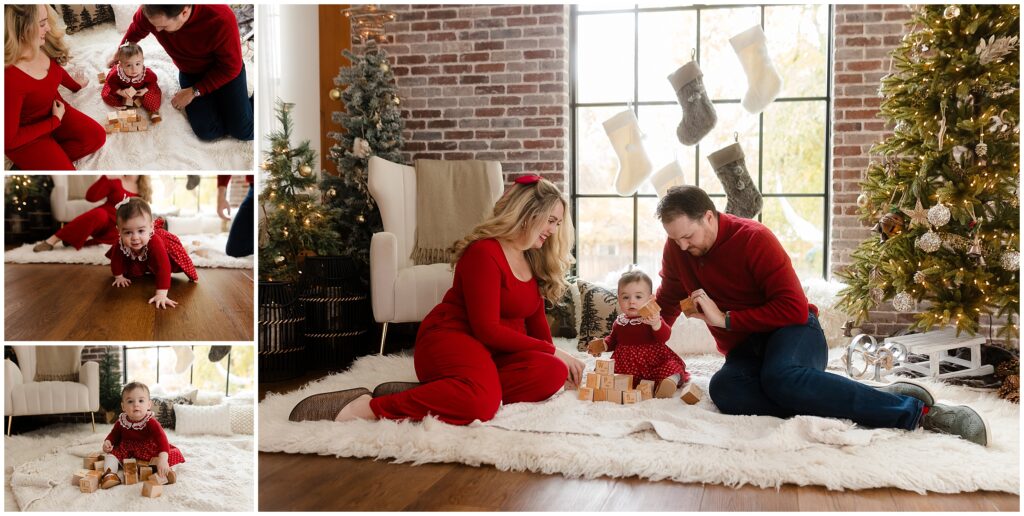 playful holiday activities with kids sometimes include just staying home. this family of 3 is playing quietly with blocks in front of a christmas tree