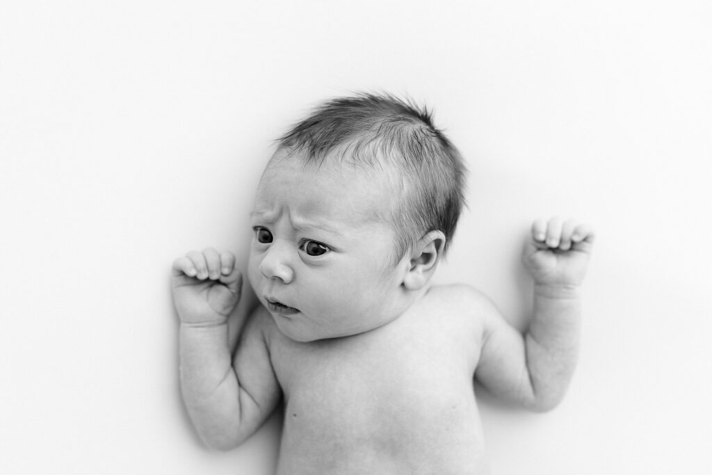 photo retouching ethics mean not removing forehead lines like the newborn baby in this photo has from her skeptical expression