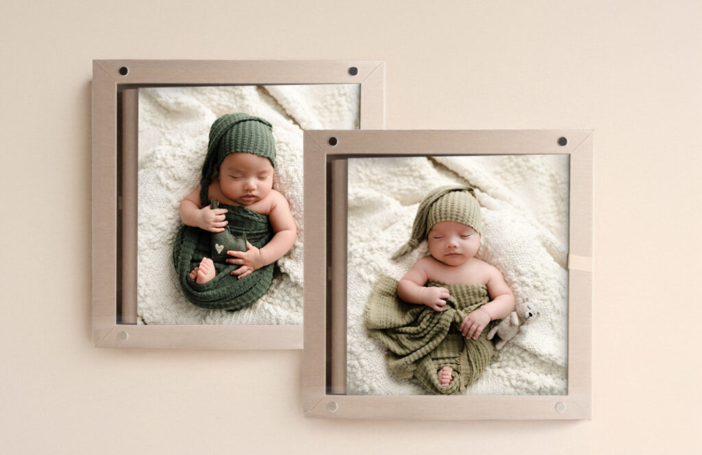Two custom twin baby albums side by side showing individual newborn portraits and twin photos from Boise maternity and newborn photographer