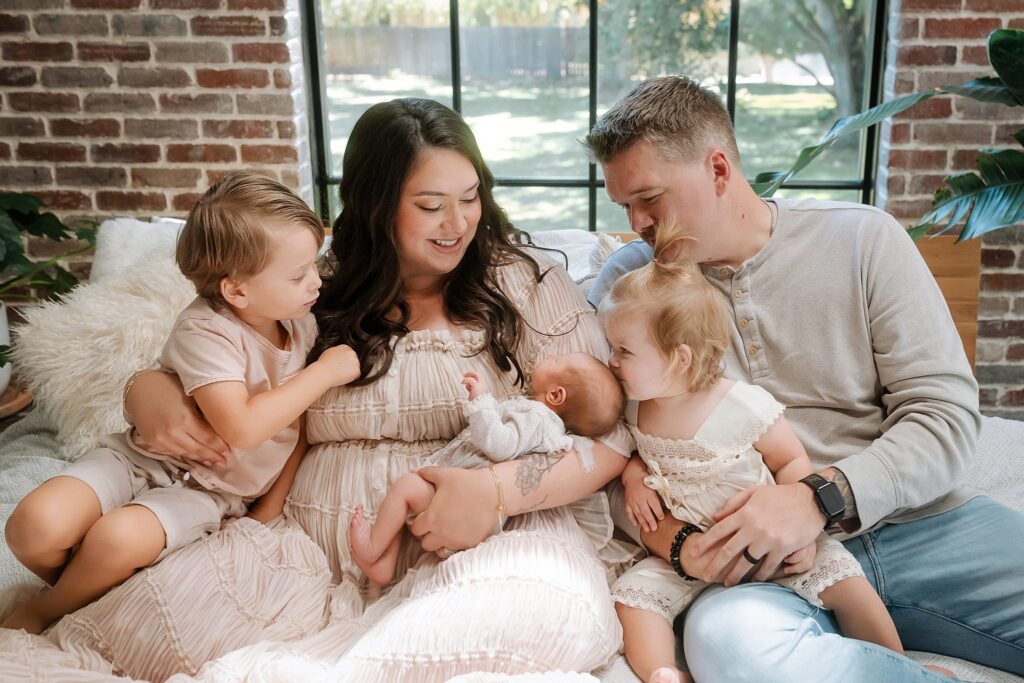 How to prepare child for new baby: two siblings with newborn during Boise newborn photography session